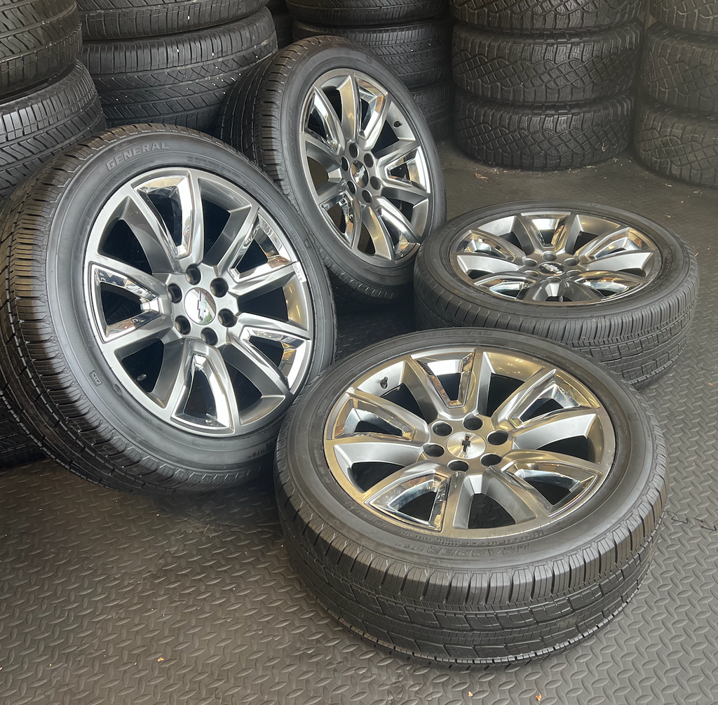 OEM 22” Wheels with Hypersilver Finish & Chrome Inserts wrapped in General Grabber tires.