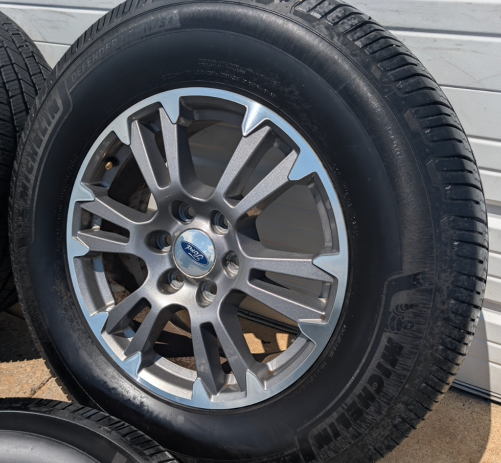 Gray Machined Ford F-150 Lariat OEM 18” Wrapped in Michelin Defender LTX 275/65R18