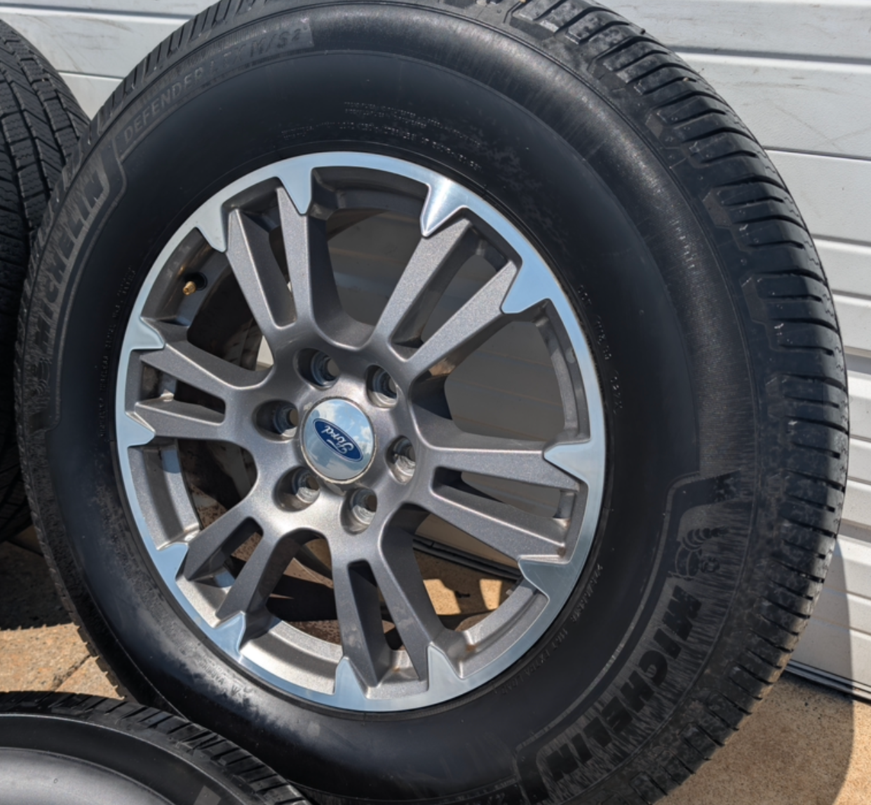Gray Machined Ford F-150 Lariat OEM 18” Wrapped in Michelin Defender LTX 275/65R18