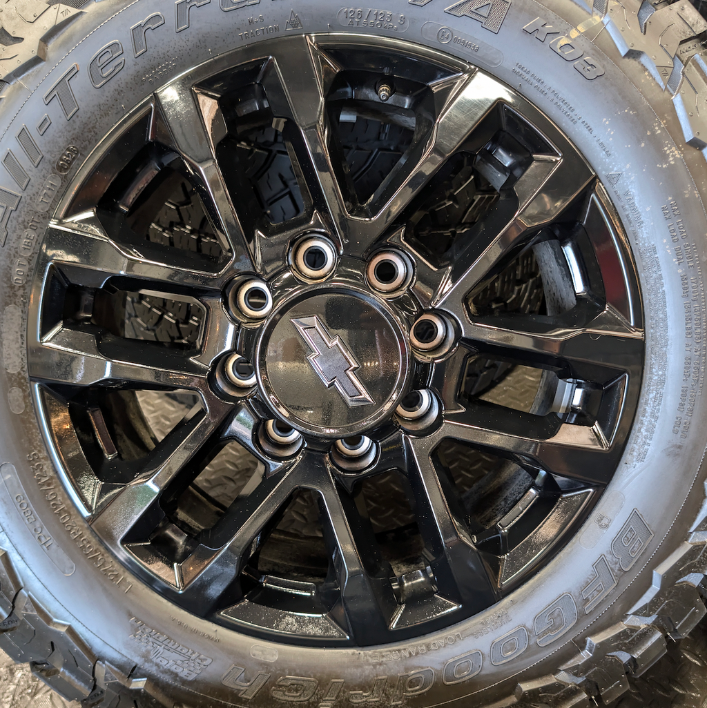 OEM 20” Black GM 2500HD / 3500HD Wheels wrapped in LT275/65R20 BFGoodrich All-Terrain T/A tires.