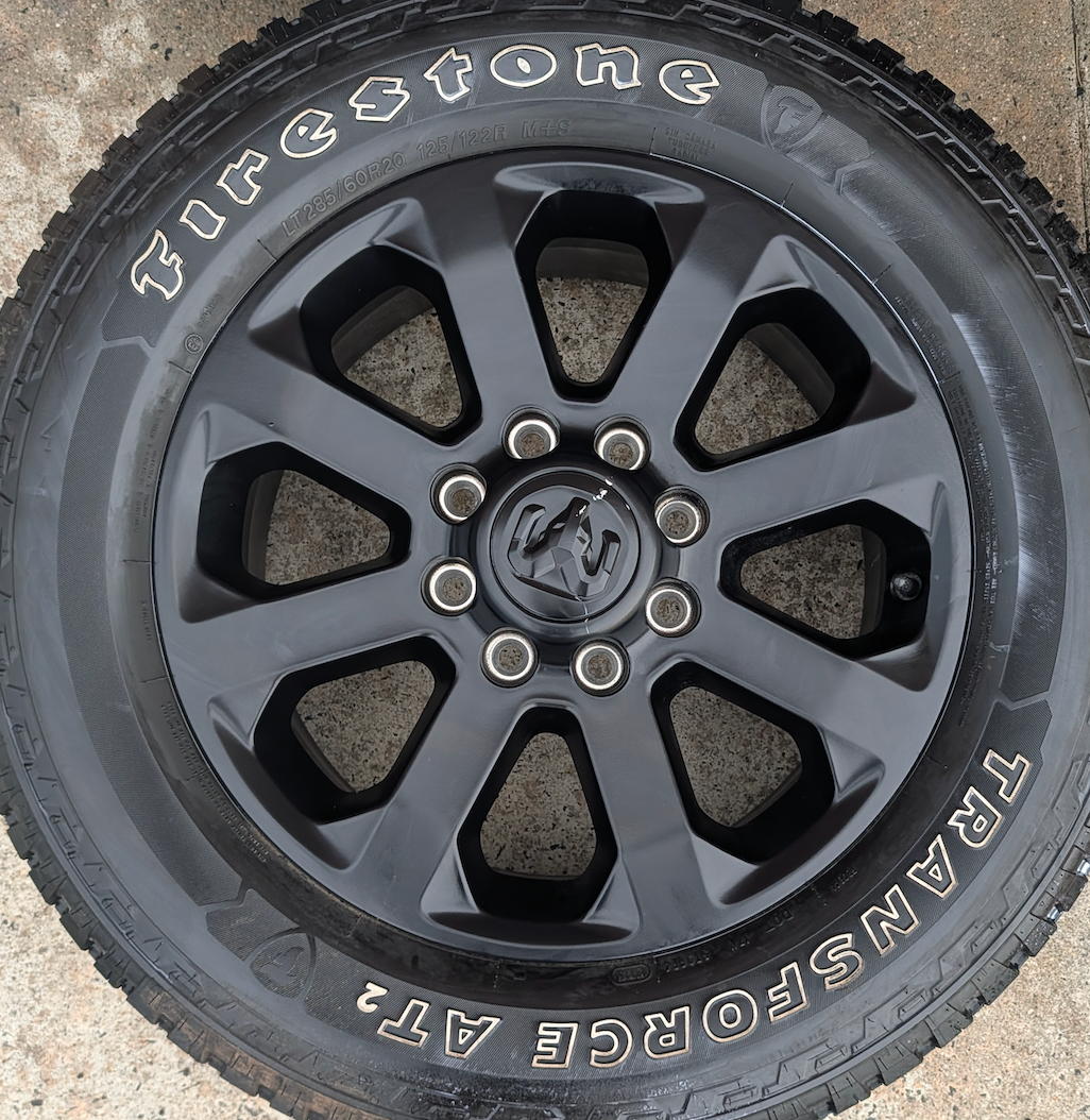 Matte Black Ram 2500 / 3500 OEM 20” Wrapped in Firestone Transforce AT2 LT285/60R20