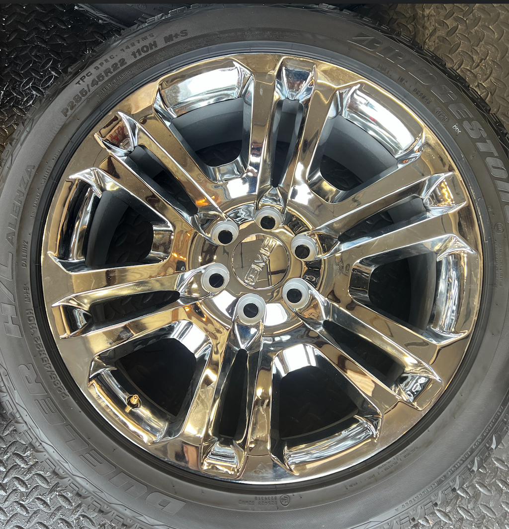 OEM 22” Split 6 Chrome Wheels wrapped in Bridgestone Dueler H/L Alenza tires.