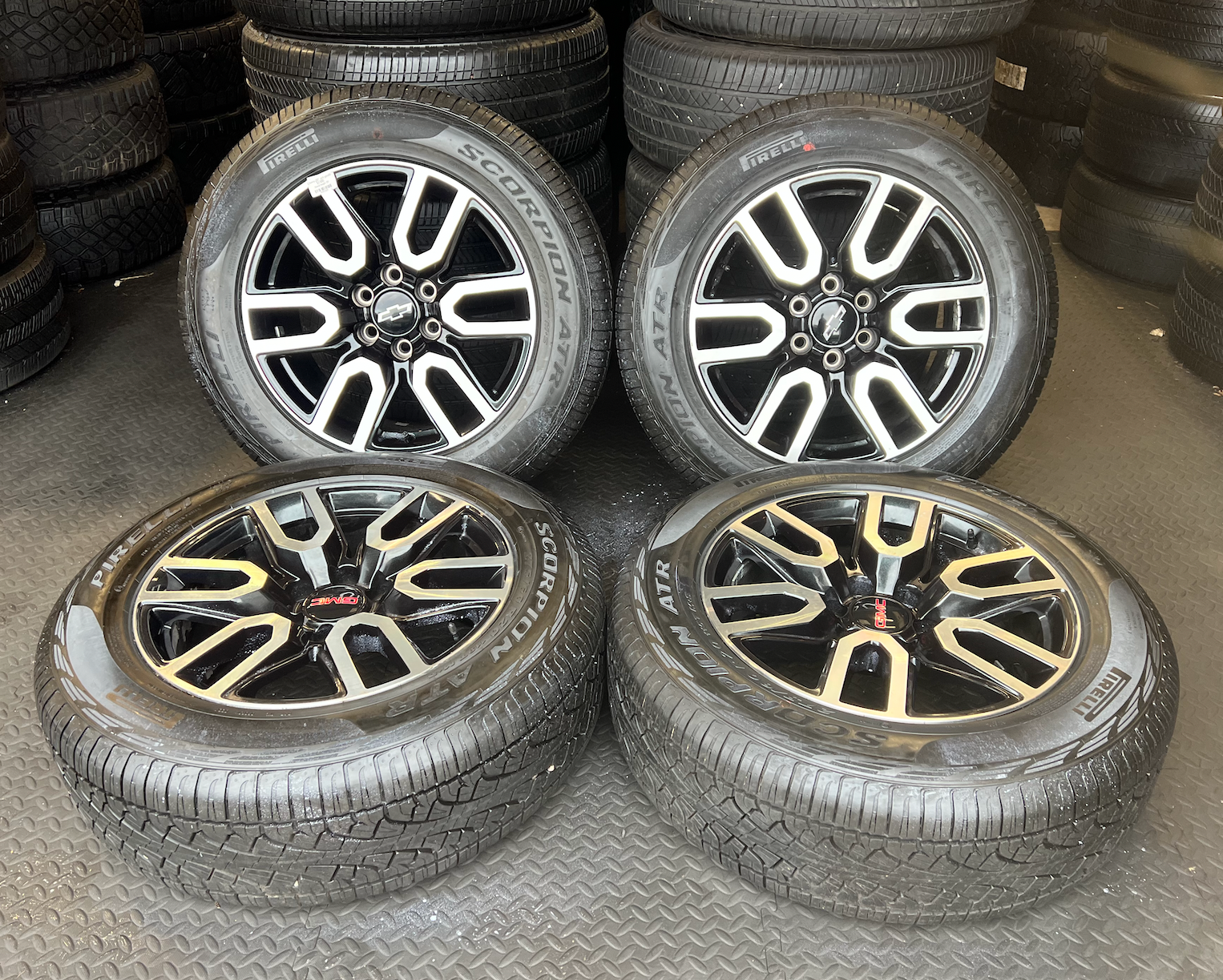OEM 20” Gloss Black Wheels with Silver Inserts / Accents wrapped in 275/60R20 Pirelli Scorpion A/T tires.