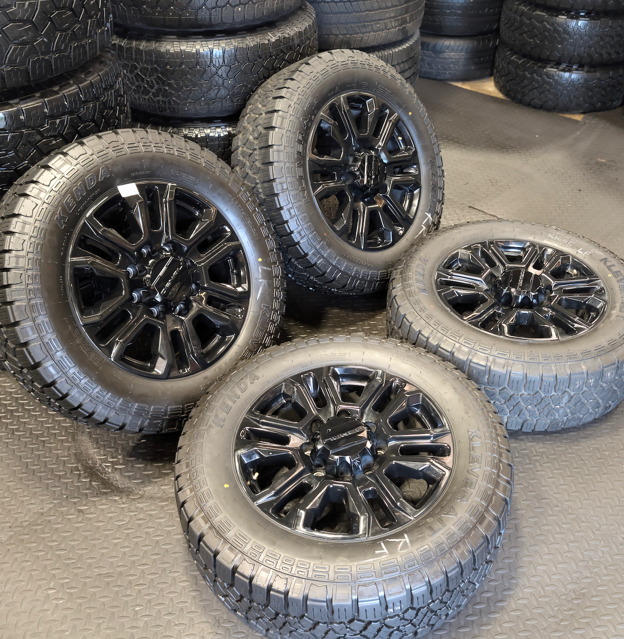 OEM 20” GMC Sierra Denali Black Wheels wrapped in Kenda Klever A/T tires.