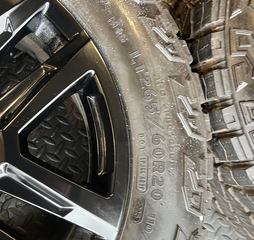 OEM 20” Gloss Black Trail Boss Wheels wrapped in Goodyear Wrangler Territory MT tires.