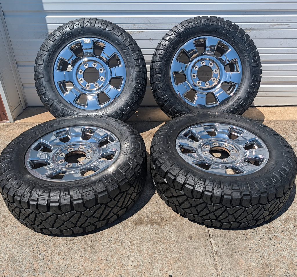 OEM 20” Chrome Ford F-250 / F-350 King Ranch / Lariat Wheels wrapped in LT275/65R20 Nitto Ridge Grappler tires.