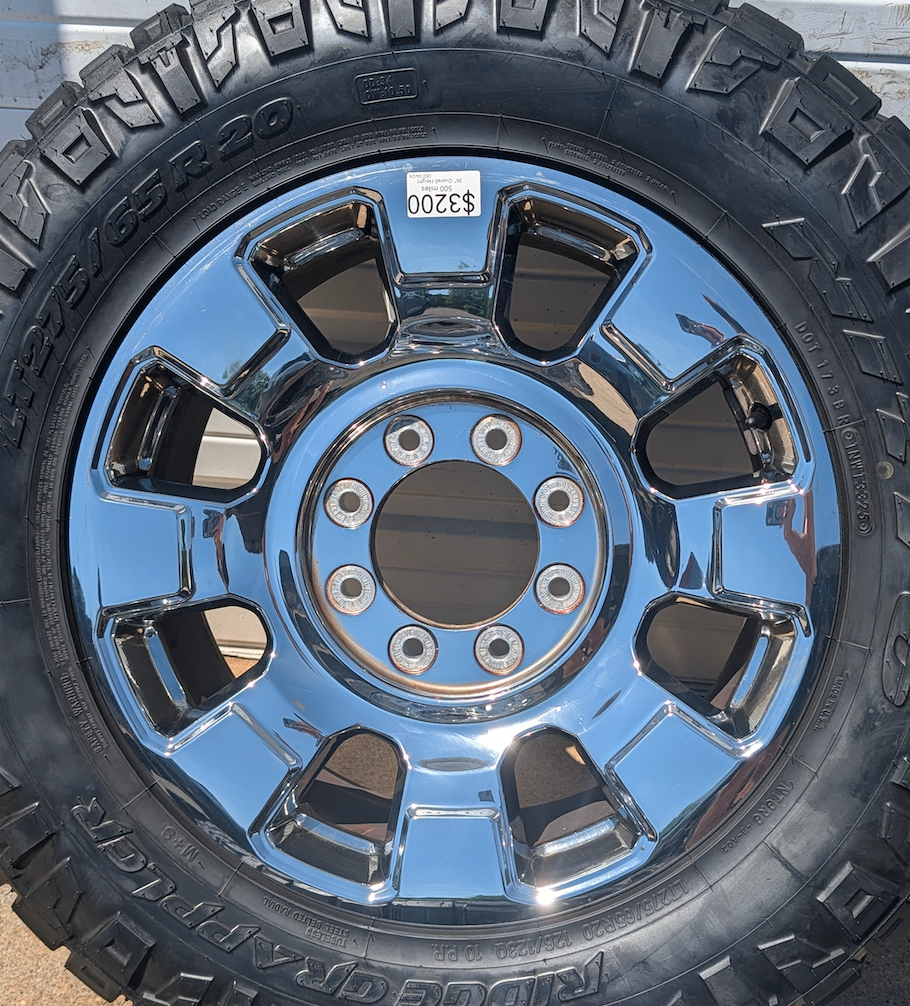 OEM 20” Chrome Ford F-250 / F-350 King Ranch / Lariat Wheels wrapped in LT275/65R20 Nitto Ridge Grappler tires.