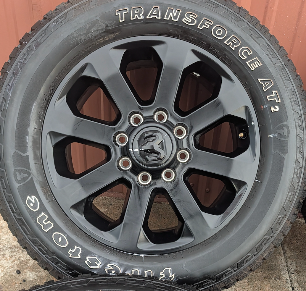 Matte Black Ram 2500 / 3500 OEM 20” Wrapped in Firestone Transforce AT2 LT285/60R20