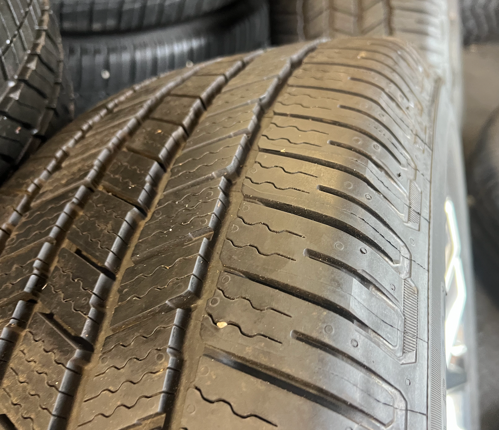 OEM 22” Polished 6-Split-Spoke Wheels wrapped in Bridgestone tires.