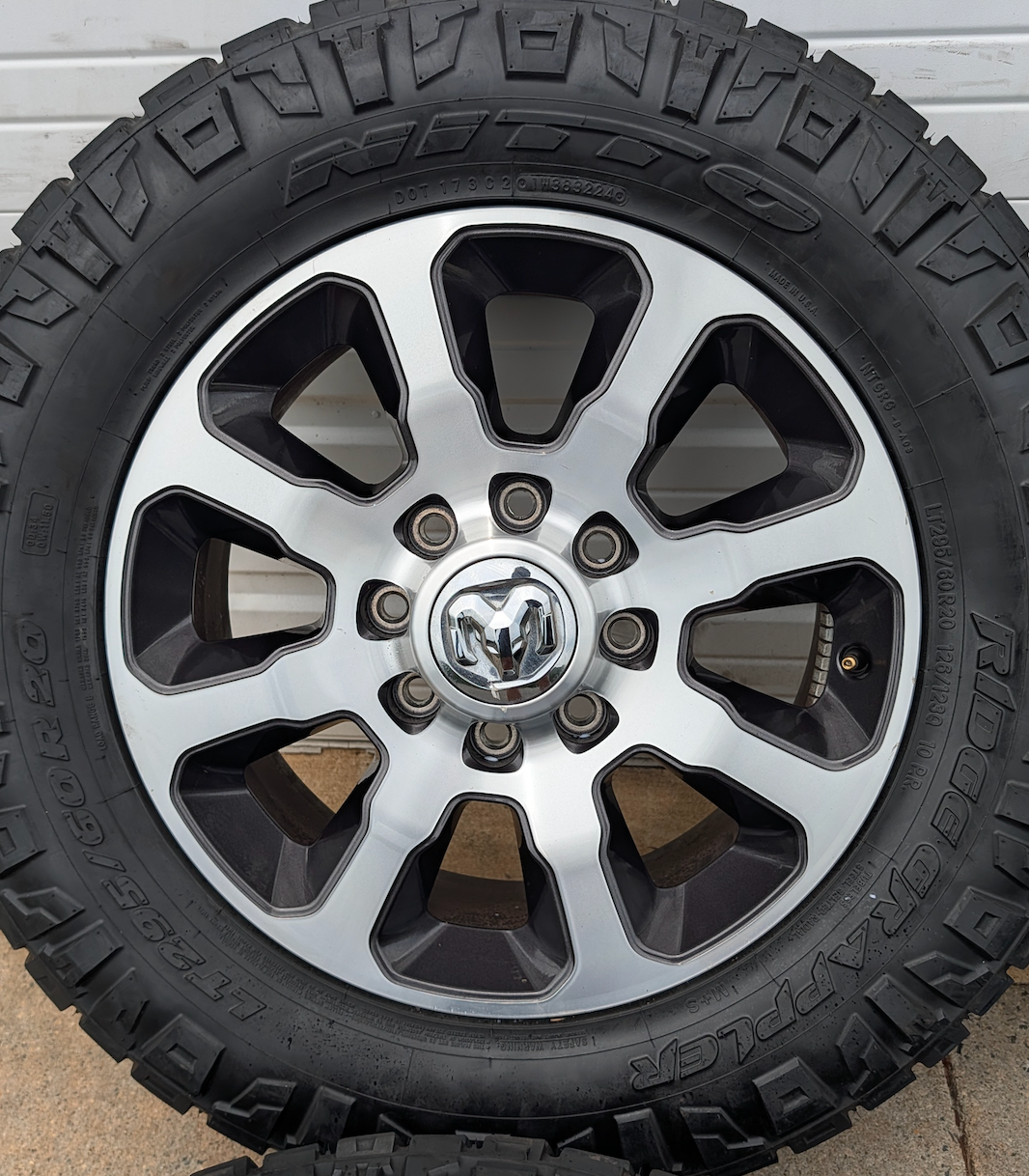 Machined Ram 2500 / 3500 OEM 20” Wrapped in Nitto Ridge Grappler LT295/60R20