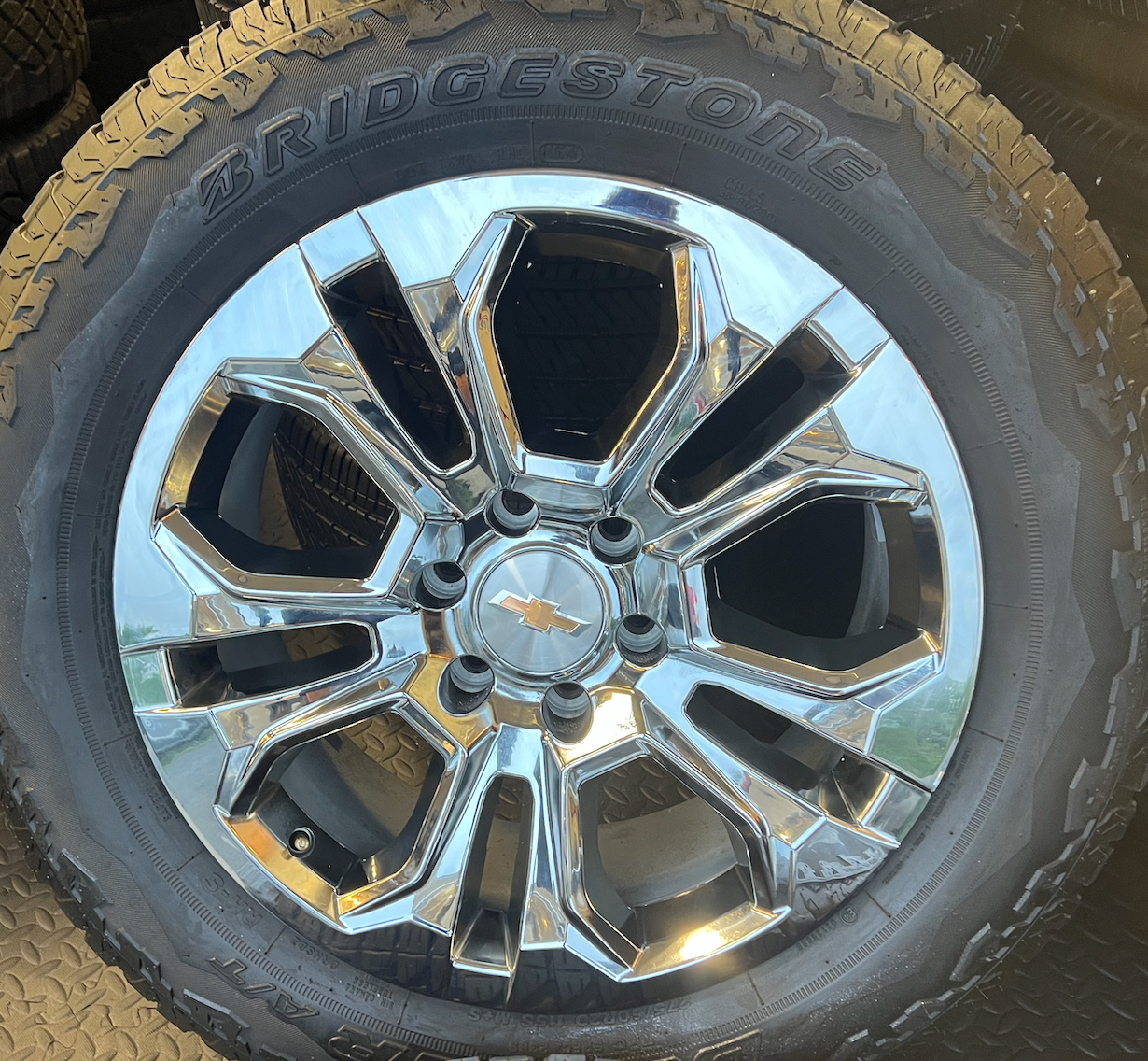 OEM 20” Chrome Wheels wrapped in Bridgestone Dueler tires.
