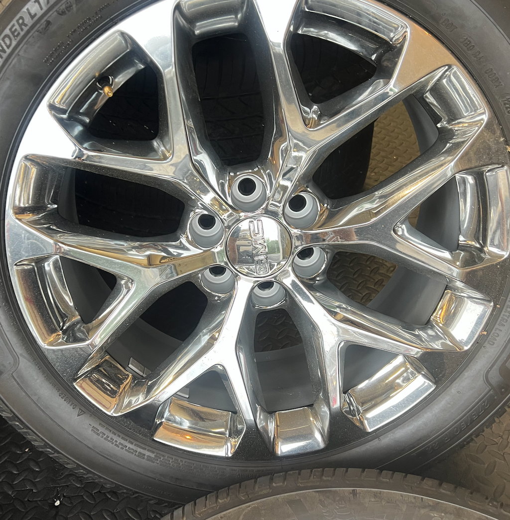 OEM 22” Polished 6-Split-Spoke Wheels wrapped in Bridgestone tires.