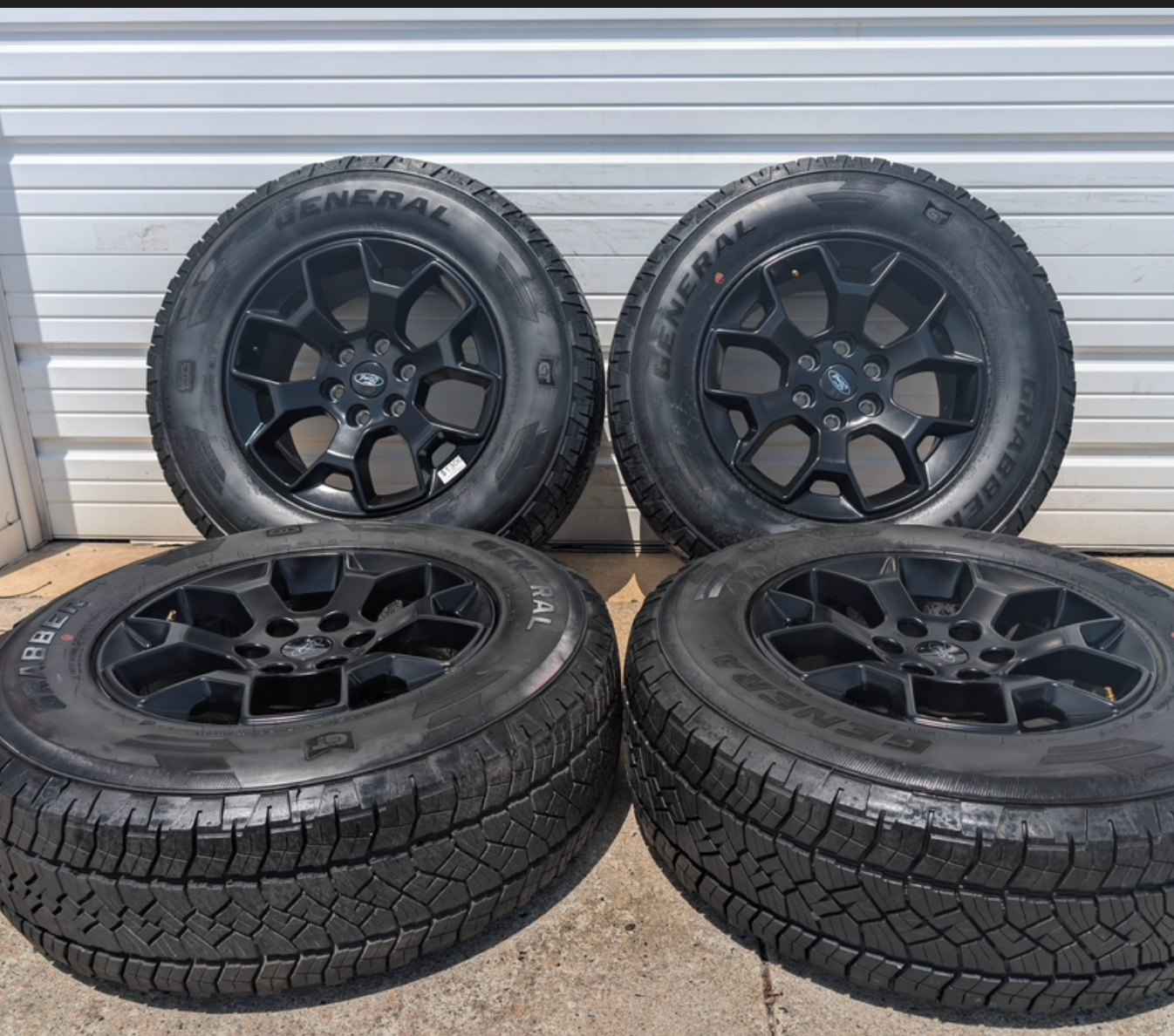Matte Black Ford F-150 Tremor OEM 18” Wrapped in General Grabber APT LT265/70R18