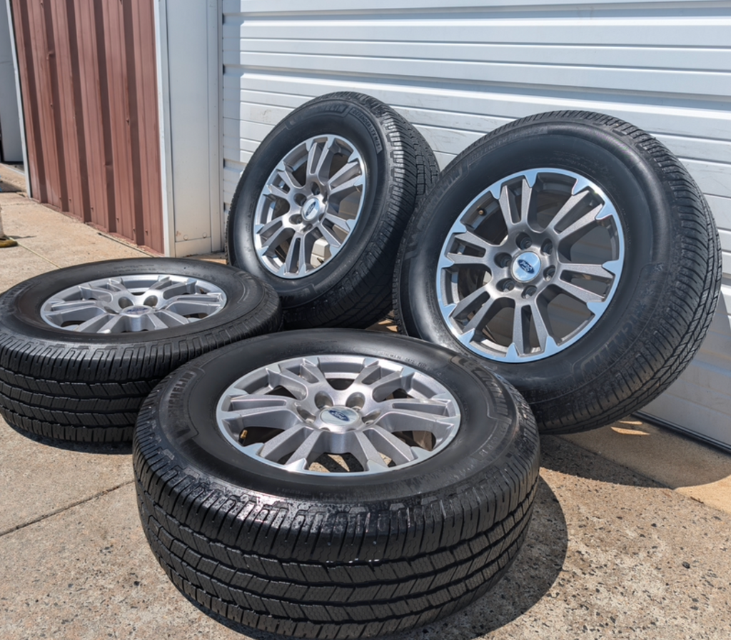 Gray Machined Ford F-150 Lariat OEM 18” Wrapped in Michelin Defender LTX 275/65R18
