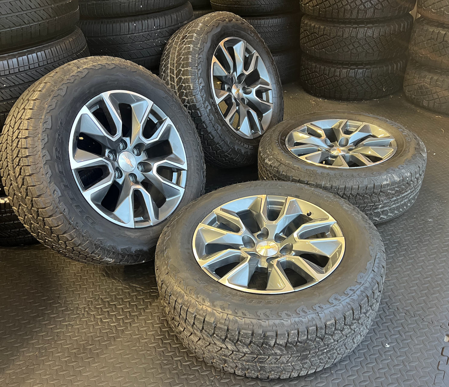OEM 20” Gunmetal & Machined RST Wheels wrapped in Bridgestone Dueler A/T tires.