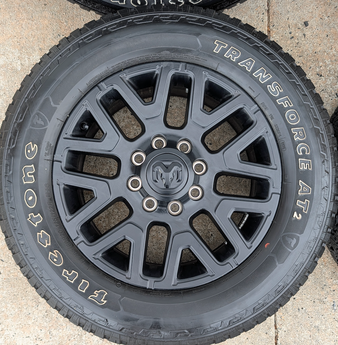 Matte Black Ram 2500 / 3500 OEM 20” Wrapped in Firestone Transforce AT2 LT285/60R20