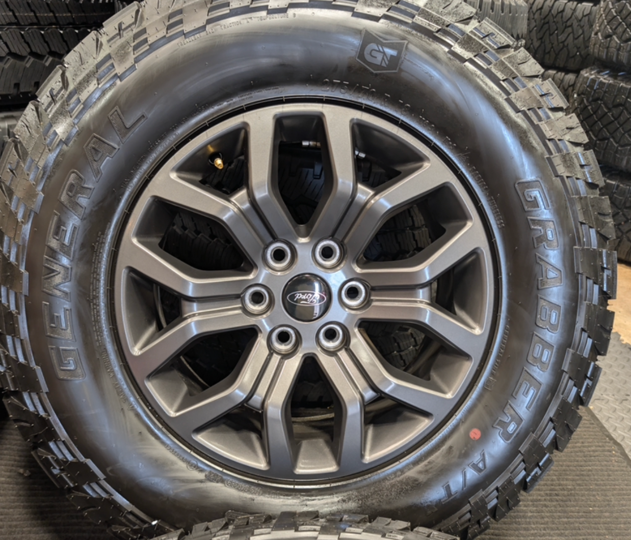 Gray Ford F-150 Tremor OEM 18” Wrapped in General Grabber A/TX 275/70R18