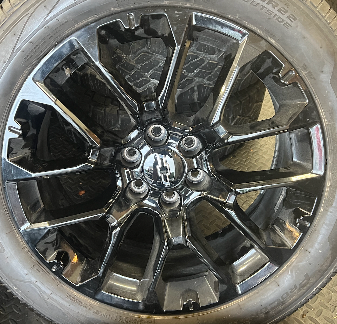 OEM 22” Gloss Black Chevrolet Wheels wrapped in Cooper ProControl tires.