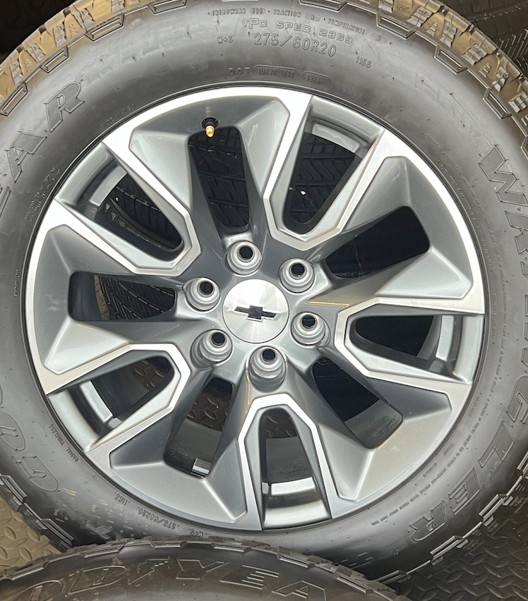 OEM 20”  Gunmetal & Machined Wheels wrapped in Goodyear Wrangler TrailRunner A/T tires.