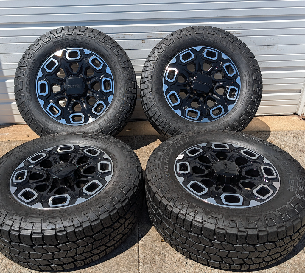 Machined Black GM 2500HD / 3500HD OEM 20” Wrapped in Cooper Discoverer AT3 LT285/55R20