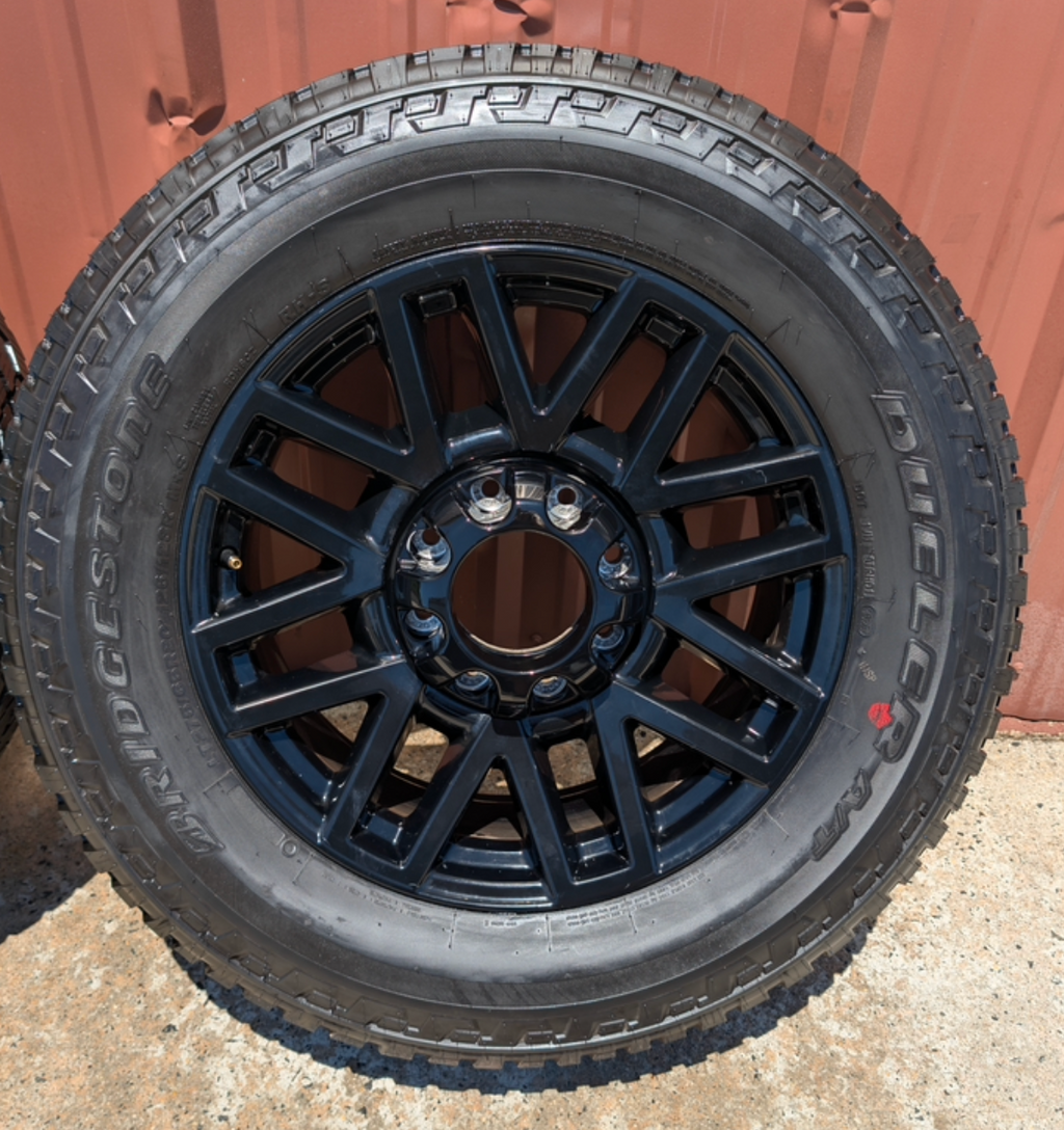 OEM 20” Chevrolet Silverado RST Gunmetal & Machined Wheels wrapped in Goodyear Wrangler TrailRunner A/T tires.
