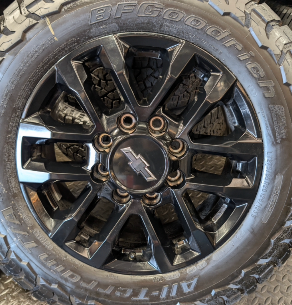 OEM 20” Black GM 2500HD / 3500HD Wheels wrapped in LT275/65R20 BFGoodrich All-Terrain T/A tires.