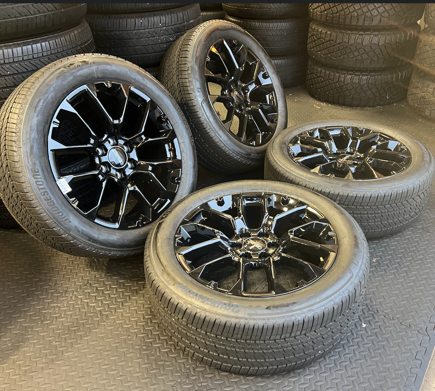 OEM 22” Gloss Black 6-Split-Spoke Replica Wheels wrapped in Bridgestone tires.
