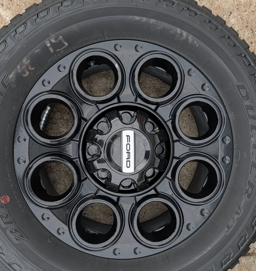 Gloss Black Ford F-250 / F-350 Super Duty Tremor OEM 20” Wrapped in Bridgestone Dueler A/T LT275/65R20