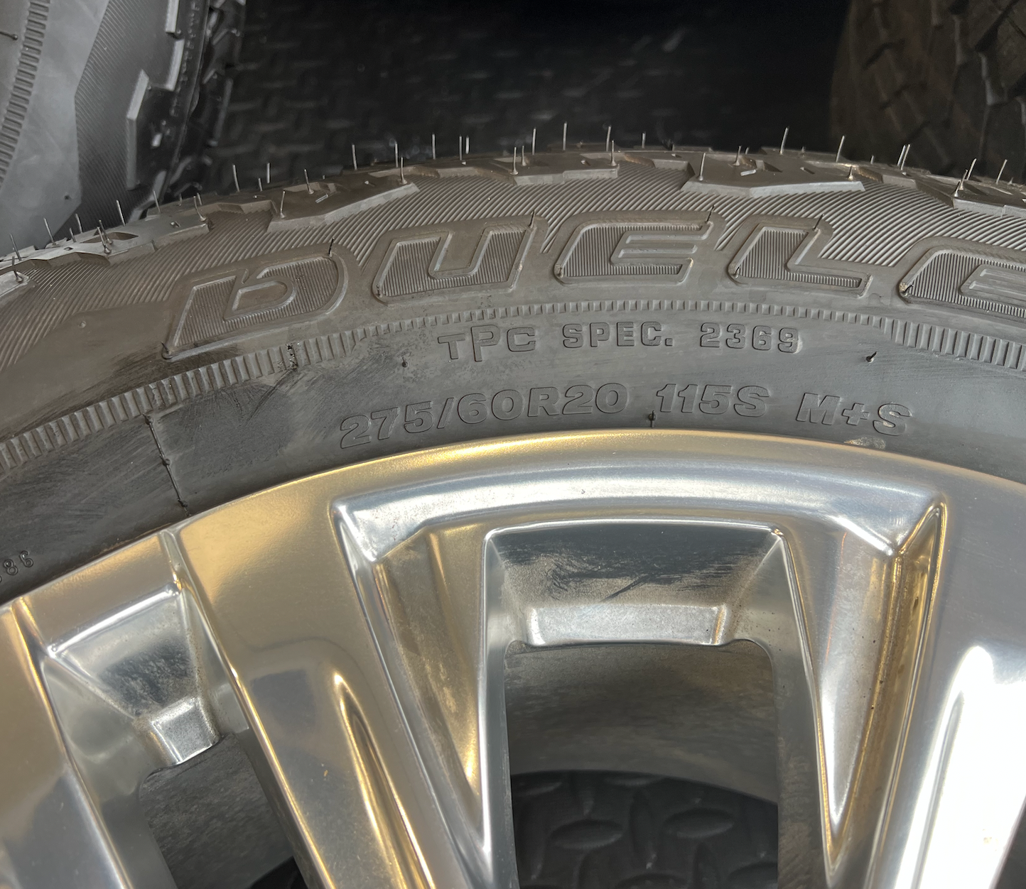 OEM Rebuilt 20” Polished Wheels wrapped in Bridgestone Dueler tires.