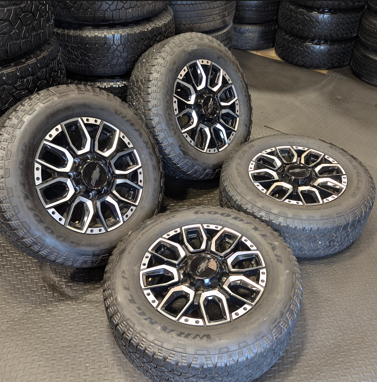 OEM 20” Machined GM 2500HD / 3500HD Wheels wrapped in Goodyear Wrangler TrailRunner A/T tires.