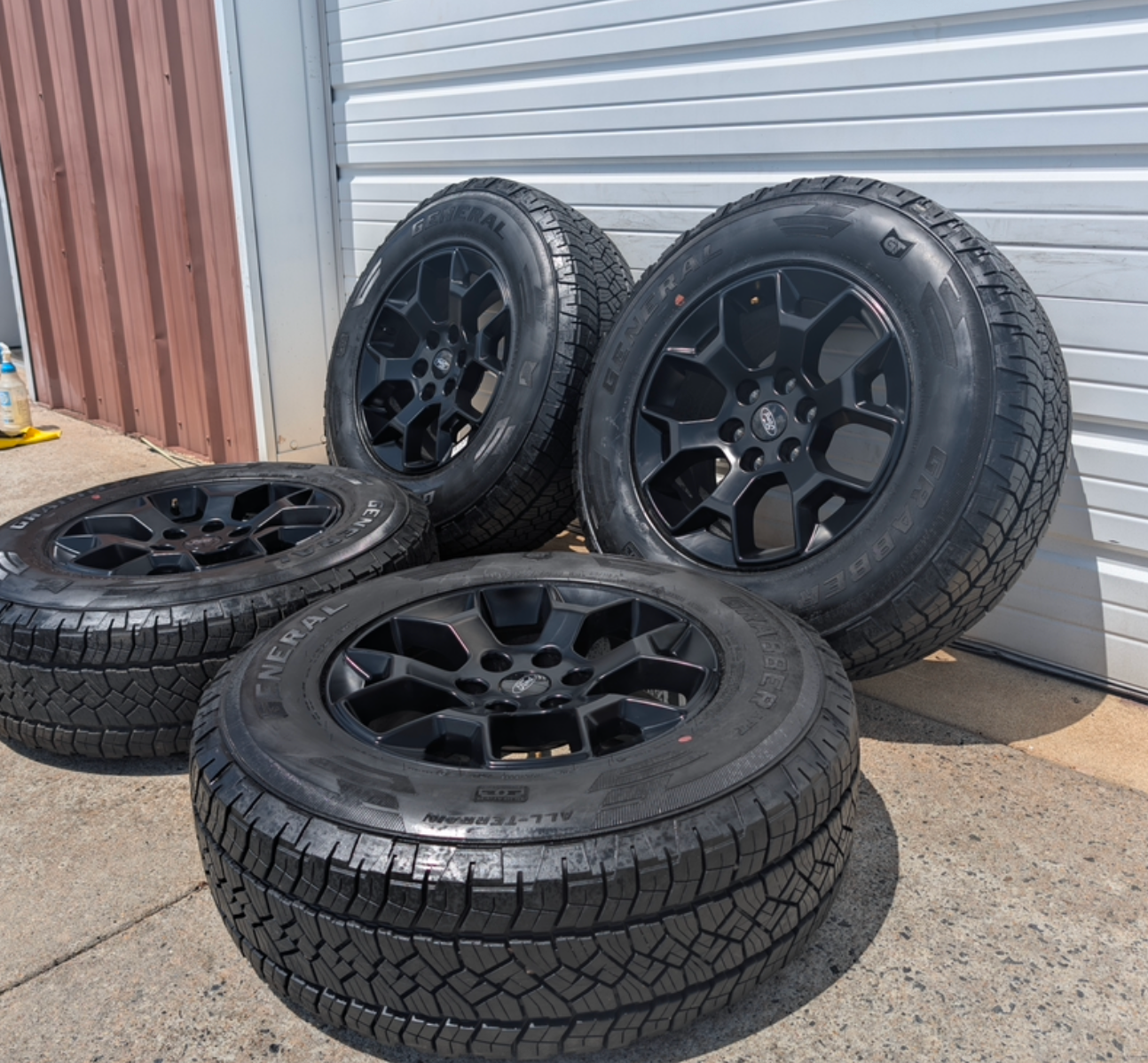 Matte Black Ford F-150 Tremor OEM 18” Wrapped in General Grabber APT LT265/70R18