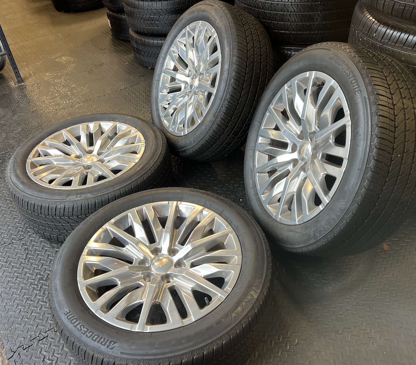 OEM 22” Polished 6-Split-Spoke Chevrolet Wheels wrapped in Bridgestone tires.