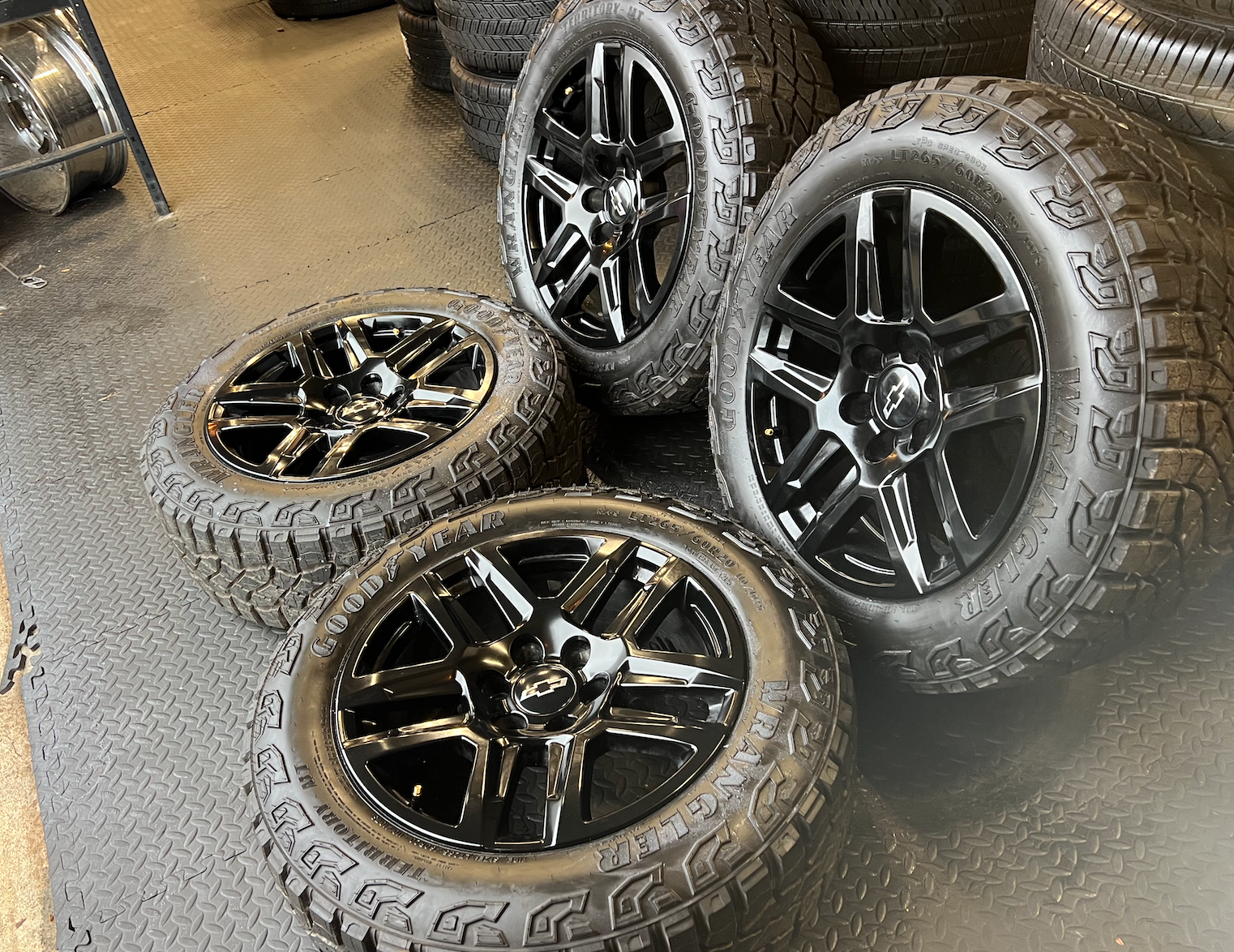 OEM 20” Gloss Black Trail Boss Wheels wrapped in Goodyear Wrangler Territory MT tires.