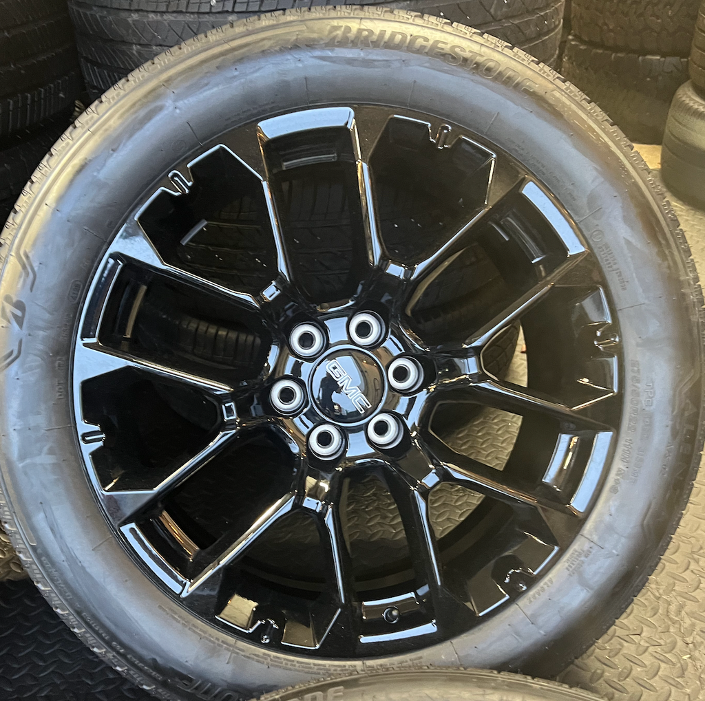 OEM 22” Gloss Black 6-Split-Spoke Replica Wheels wrapped in Bridgestone tires.