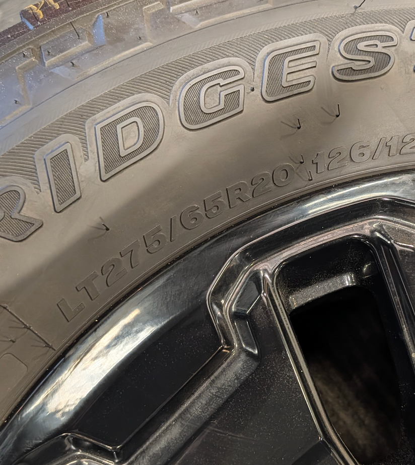 Gloss Black Ford F-250 / F-350 Tremor OEM 18” Wrapped in Bridgestone Dueler A/T LT275/65R20