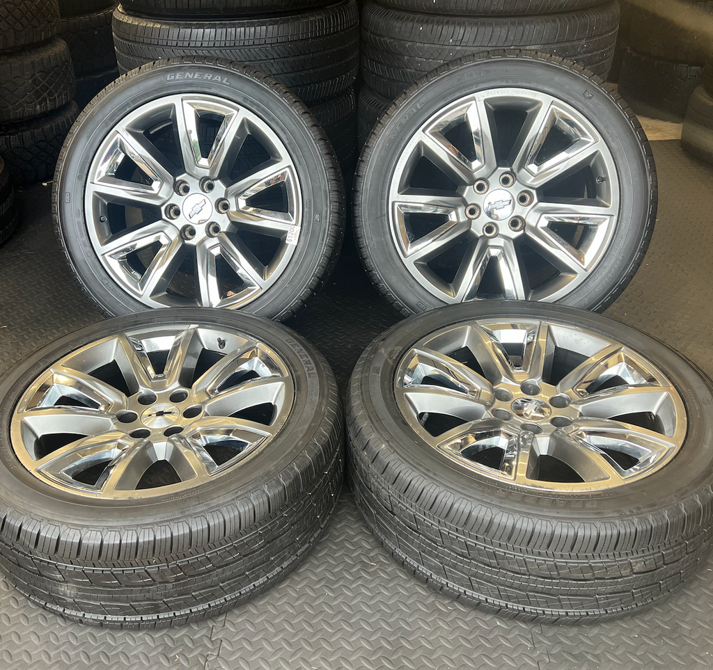 OEM 22” Wheels with Hypersilver Finish & Chrome Inserts wrapped in General Grabber tires.