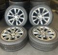 OEM 22” Wheels with Hypersilver Finish & Chrome Inserts wrapped in General Grabber tires.
