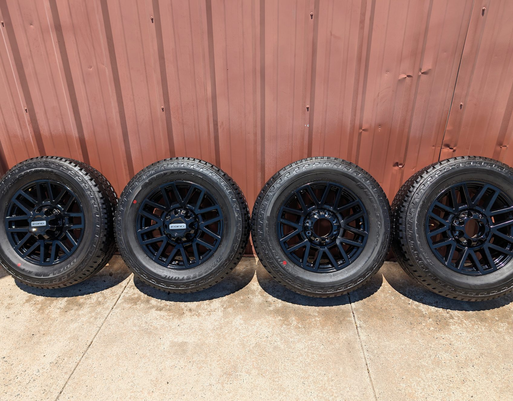 OEM 20” Chevrolet Silverado RST Gunmetal & Machined Wheels wrapped in Goodyear Wrangler TrailRunner A/T tires.