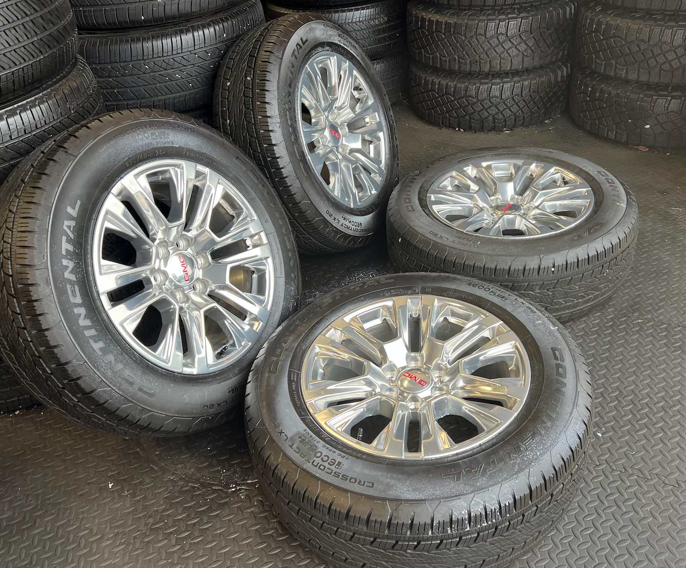 OEM 20” Polished Wheels wrapped in 20” Continental tires.