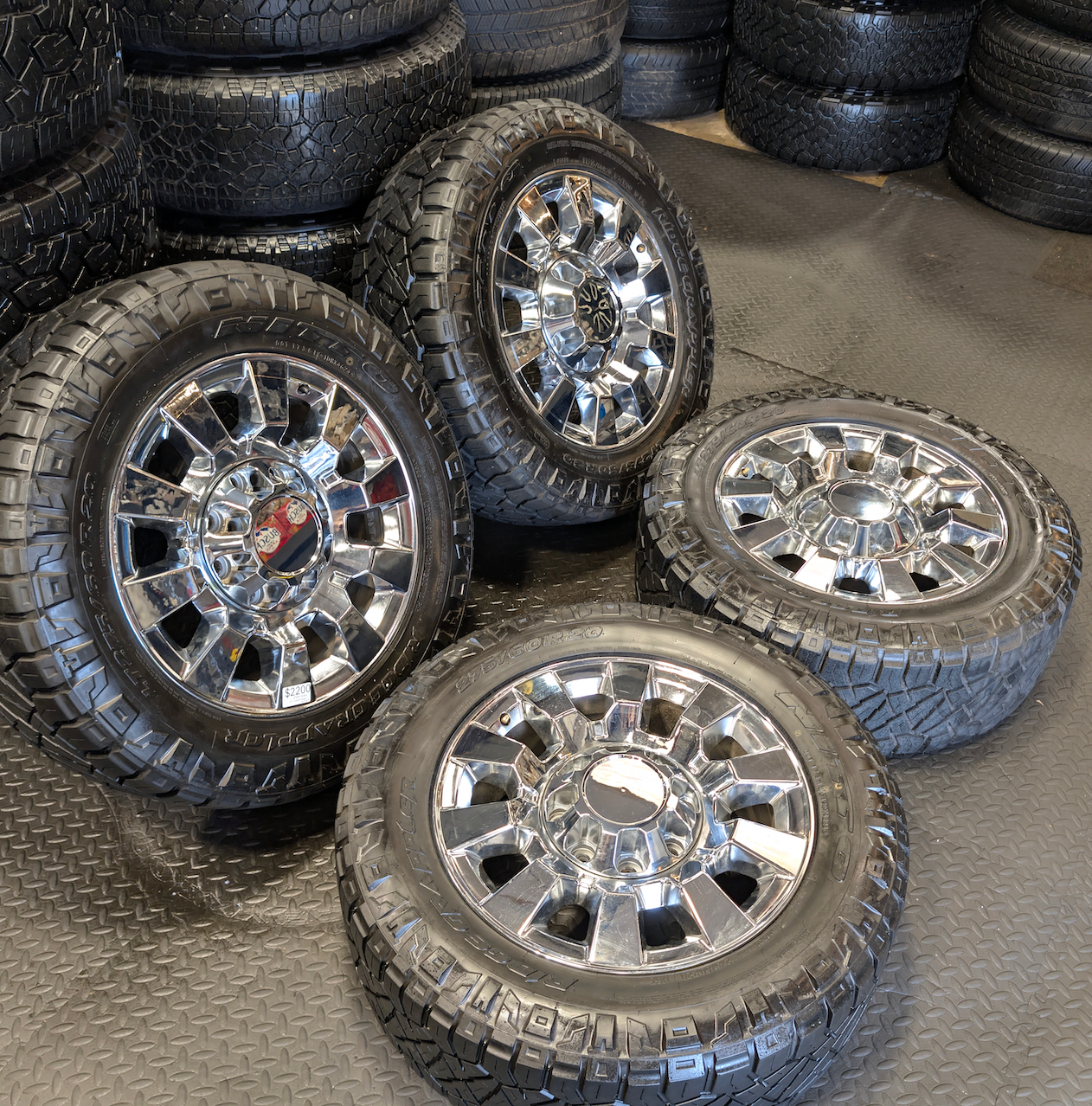 OEM 20” Chrome GMC Sierra Denali 2500HD / 3500HD Wheels wrapped in LT275/60R20 Nitto Ridge Grappler tires.