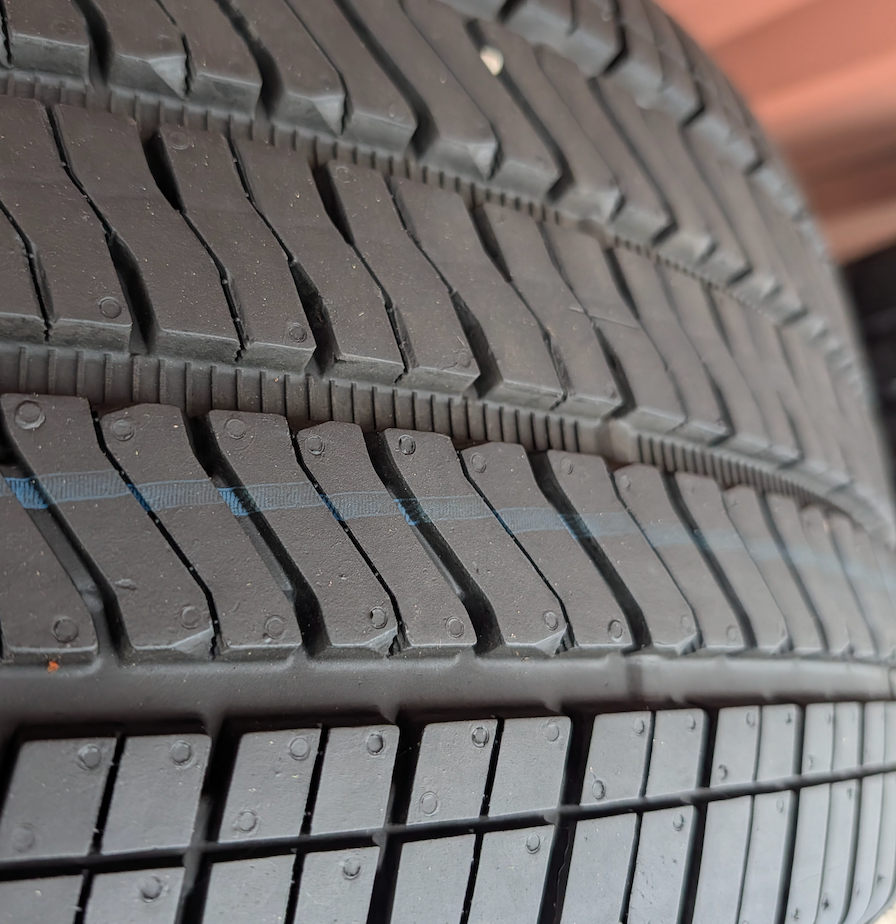 Machined Chevrolet Silverado 1500 High Country OEM 22” Wrapped in Bridgestone Alenza 275/50R22