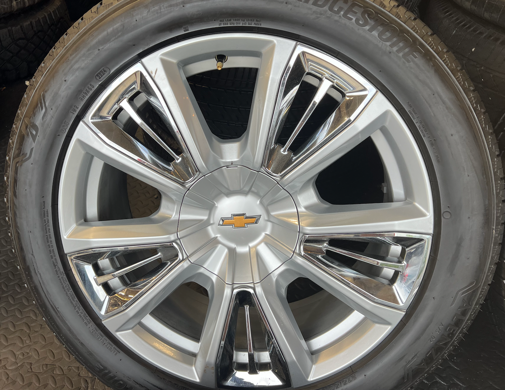OEM 22” Chevrolet High Country Wheels wrapped in Bridgestone tires.
