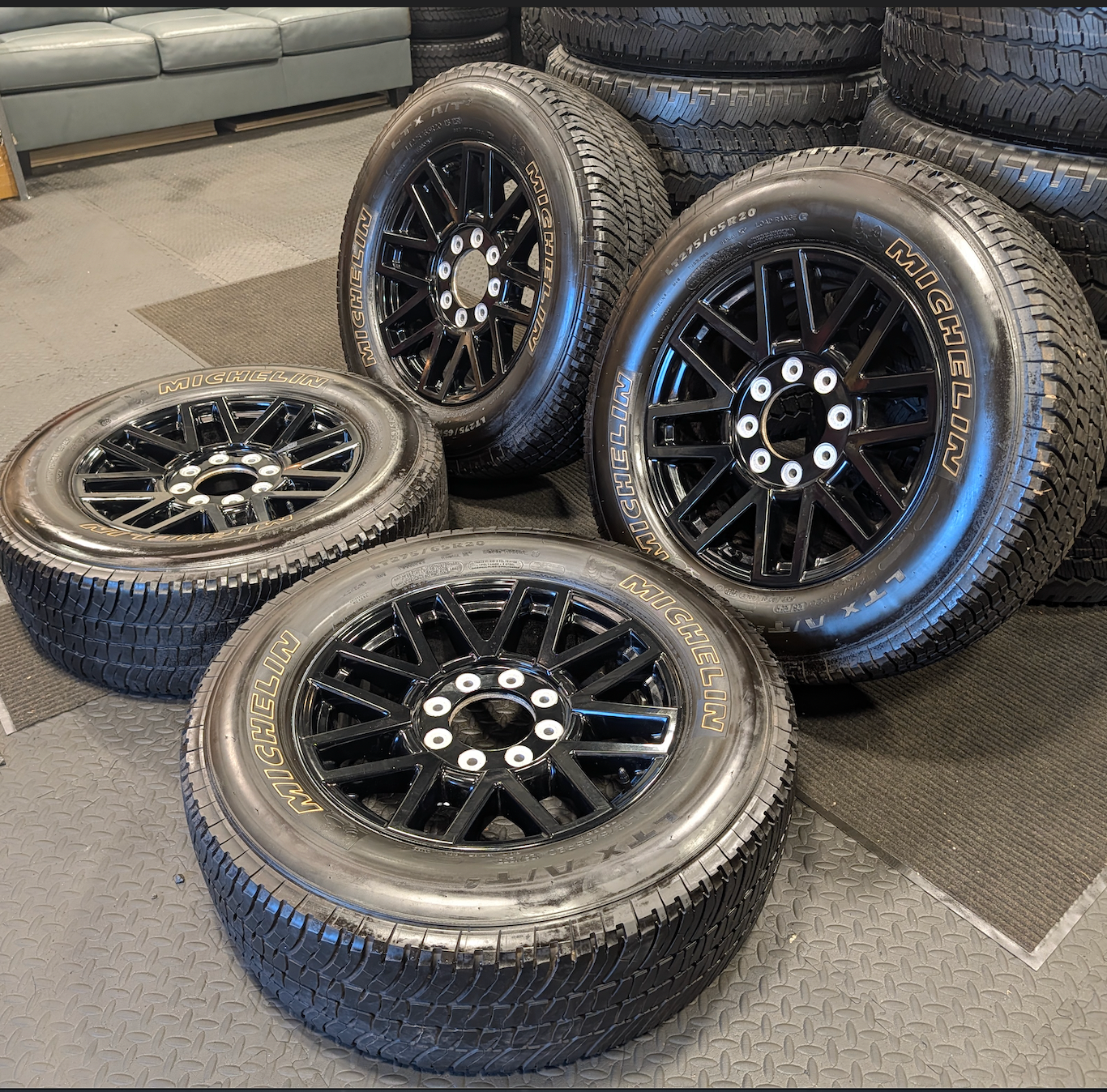 OEM 20” Gloss Black Ford F-250 / F-350 Wheels wrapped in Michelin LTX tires.