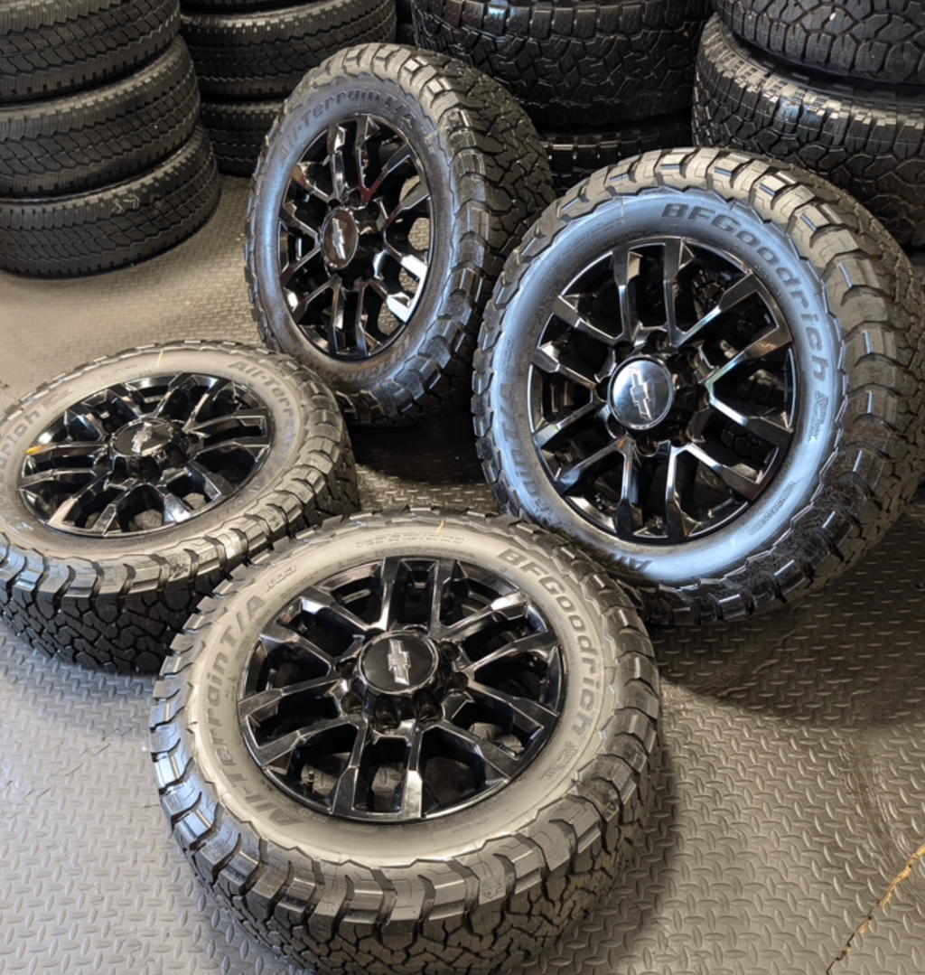 OEM 20” Black GM 2500HD / 3500HD Wheels wrapped in LT275/65R20 BFGoodrich All-Terrain T/A tires.
