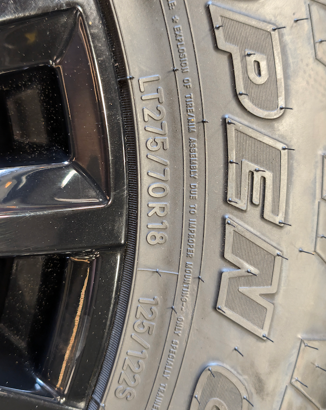 OEM 18” Chevrolet Silverado ZR2 2500HD / 3500HD Gloss Black Wheels wrapped in Toyo Open Country A/T tires.