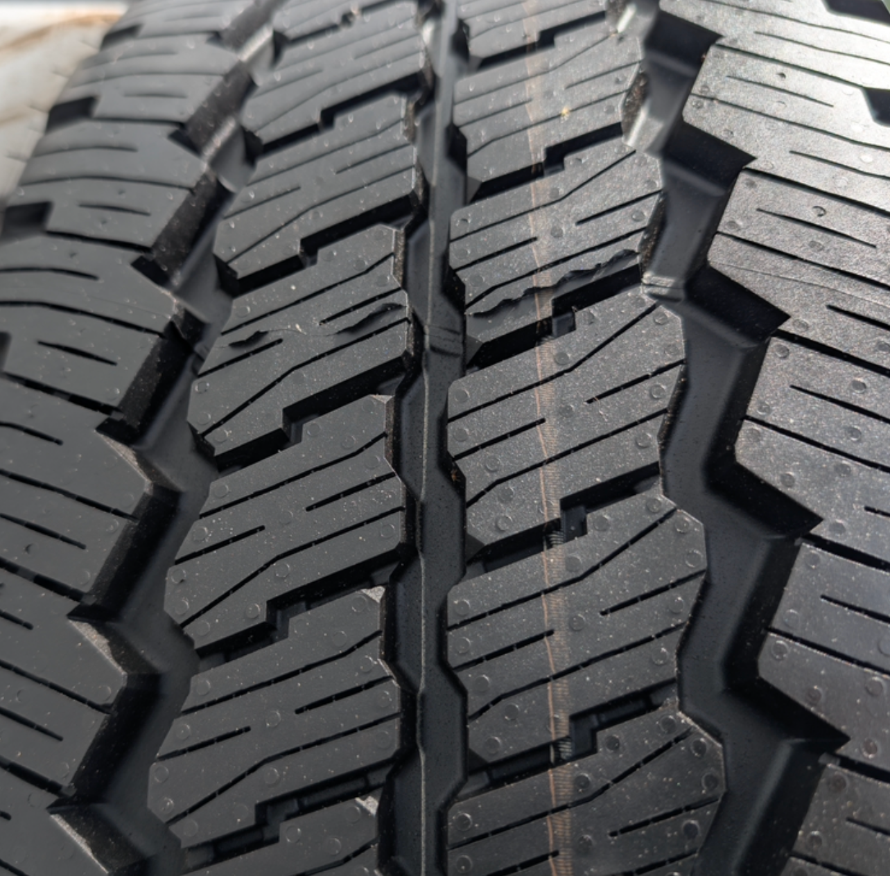 OEM 20” Chrome Ford F-250 / F-350 Wheels wrapped in Bridgestone Dueler A/T tires.