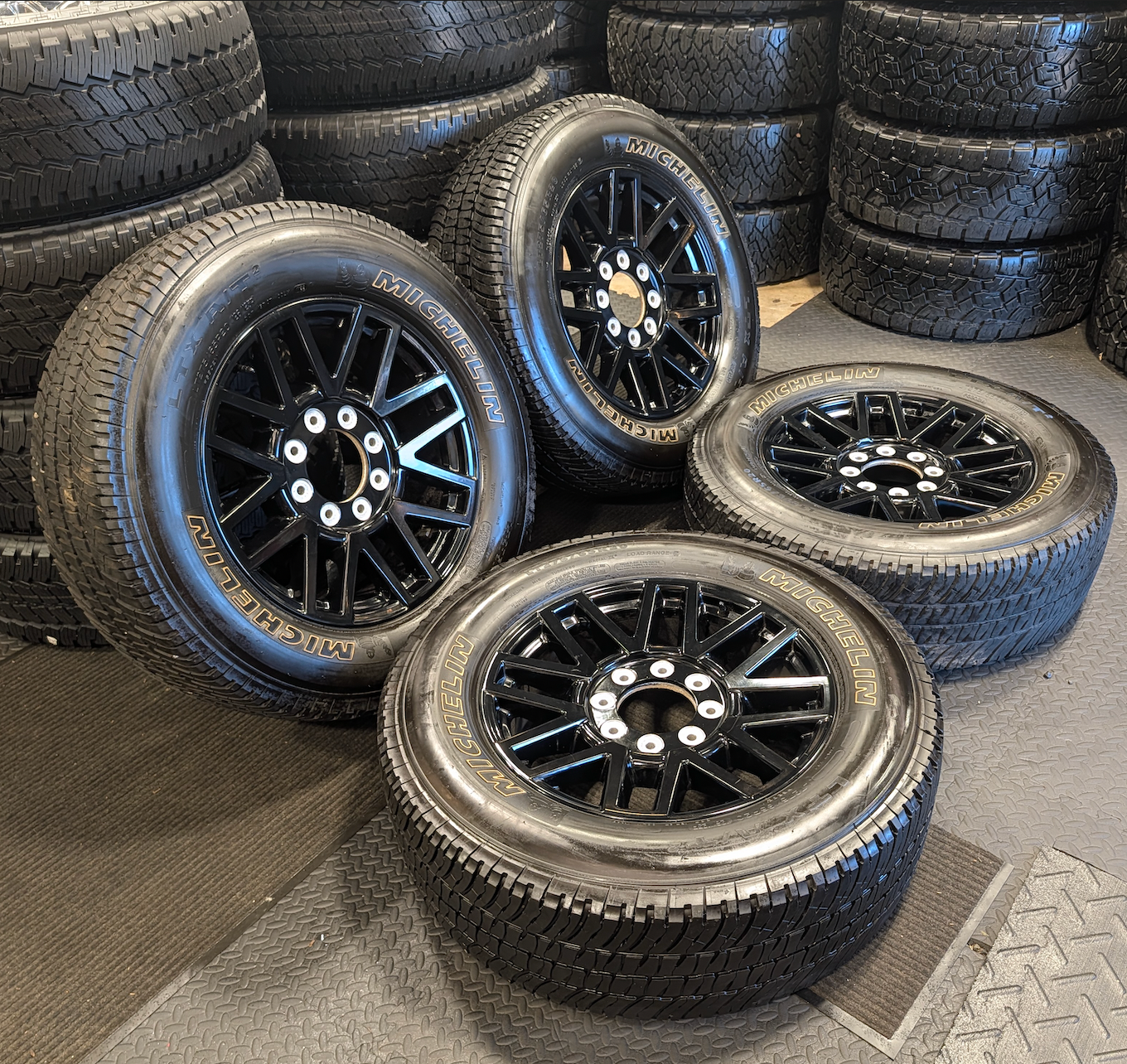 OEM 20” Gloss Black Ford F-250 / F-350 Wheels wrapped in Michelin LTX tires.