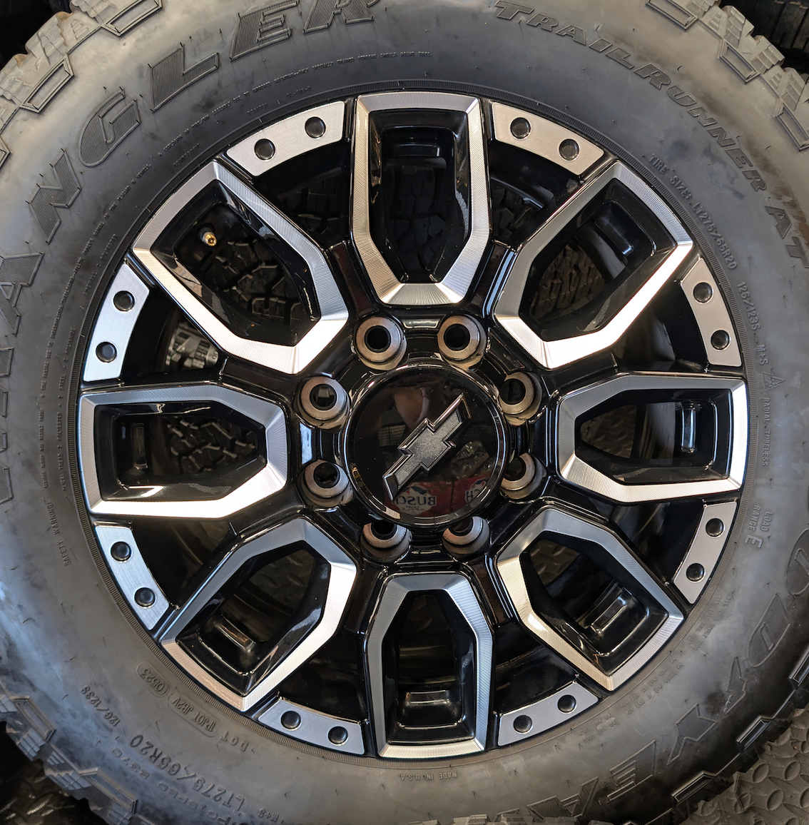 OEM 20” Machined GM 2500HD / 3500HD Wheels wrapped in Goodyear Wrangler TrailRunner A/T tires.