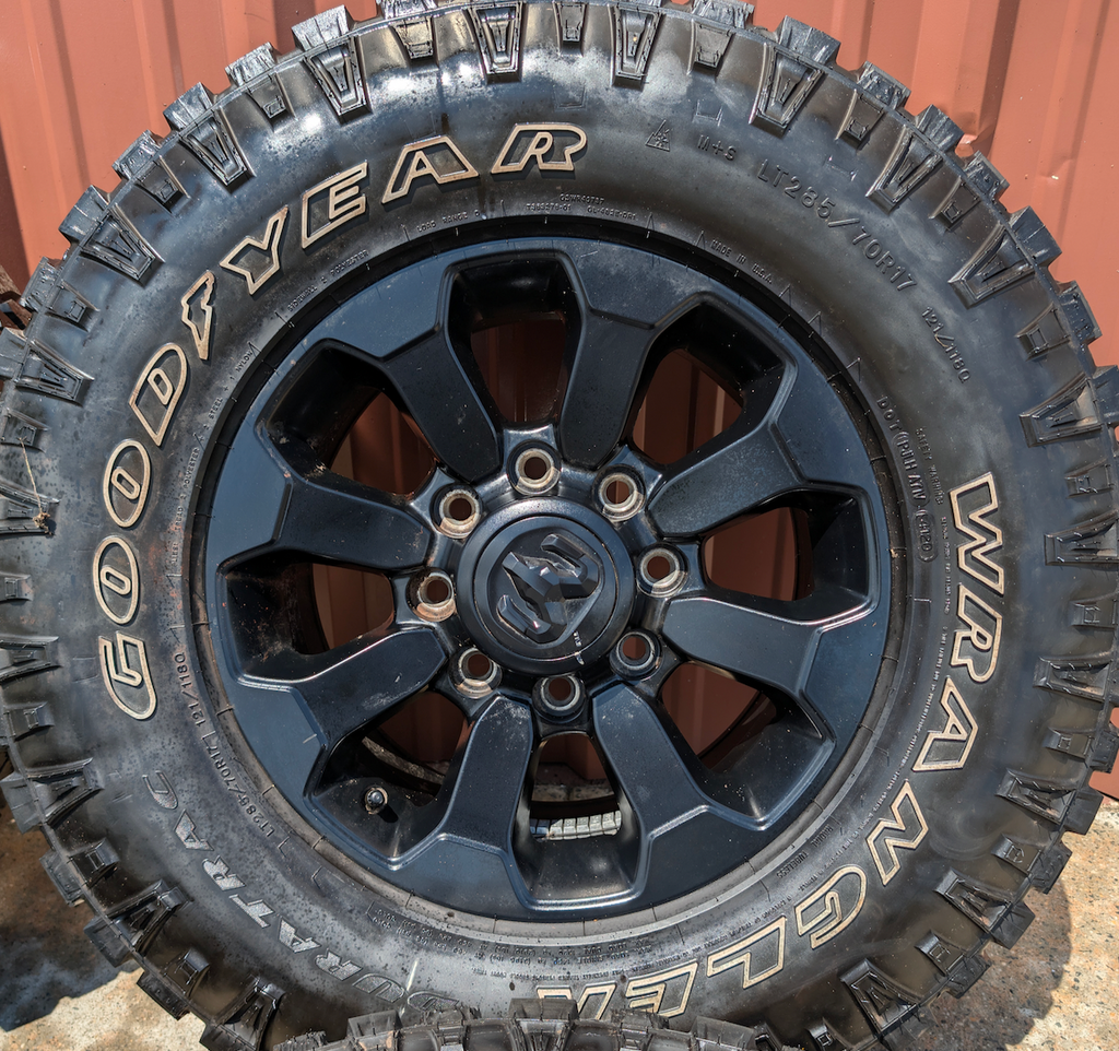 Matte Black Ram 2500 Power Wagon OEM 17” Wrapped in Goodyear Wrangler DuraTrac LT285/70R17