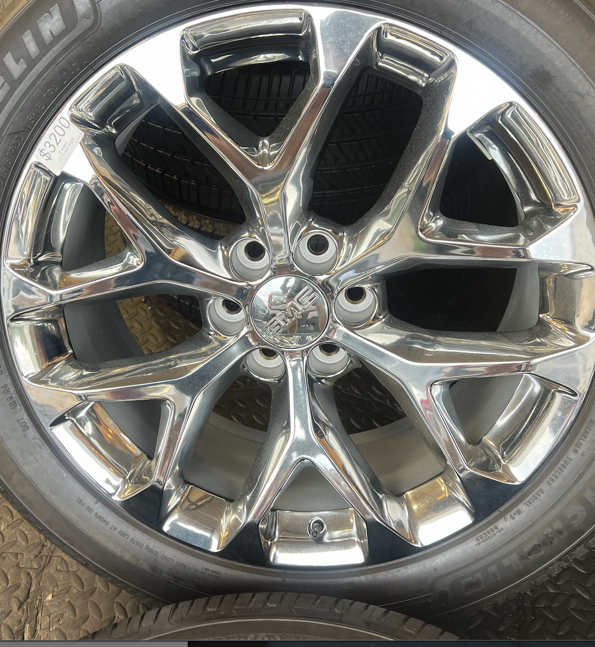 OEM 22” Polished 6-Split-Spoke Wheels wrapped in Bridgestone tires.